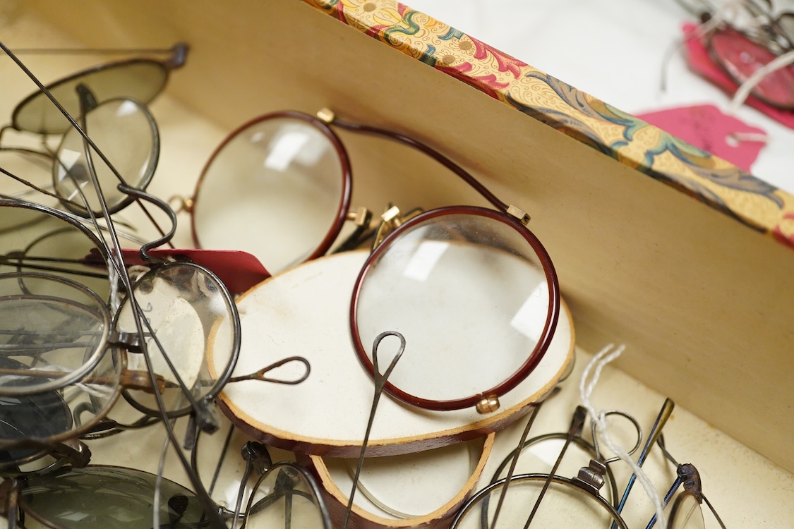 A large collection of 19th-century steel wire framed spectacles and a collection of 19th century leather, shagreen, embroidered etc. spectacle cases